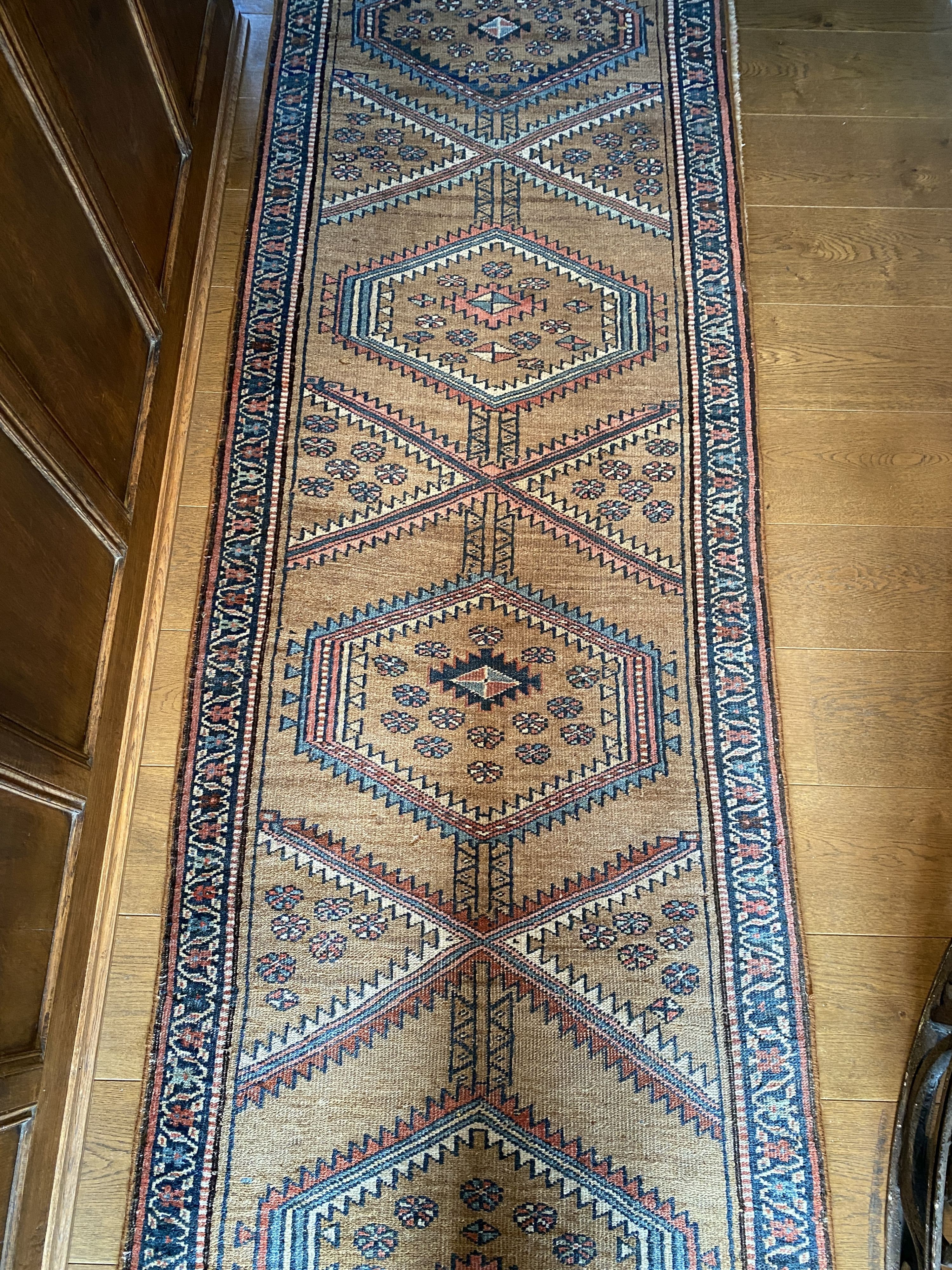 A Caucasian style pale brown ground runner, with hexagonal motifs, 382 x 77cm